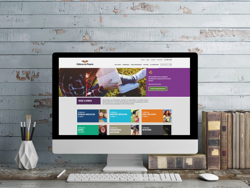 Écran d'ordinateur affichant le site web des Éditions du Phoenix avec des collections de livres colorées.