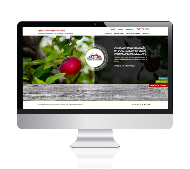 Écran d'ordinateur affichant le site Verger Lavallée avec une pomme rouge sur une branche et texte promotionnel.