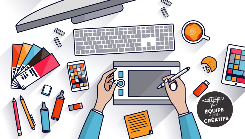 Vue de dessus d'un graphiste utilisant une tablette graphique avec clavier, smartphone, échantillons de couleurs et café.