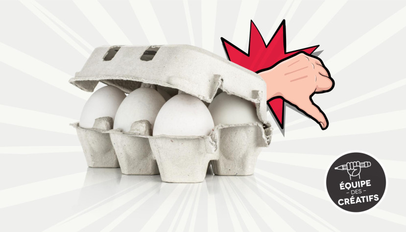 Carton d'œufs blanc avec un pouce vers le bas en dessin animé rouge et beige à côté.